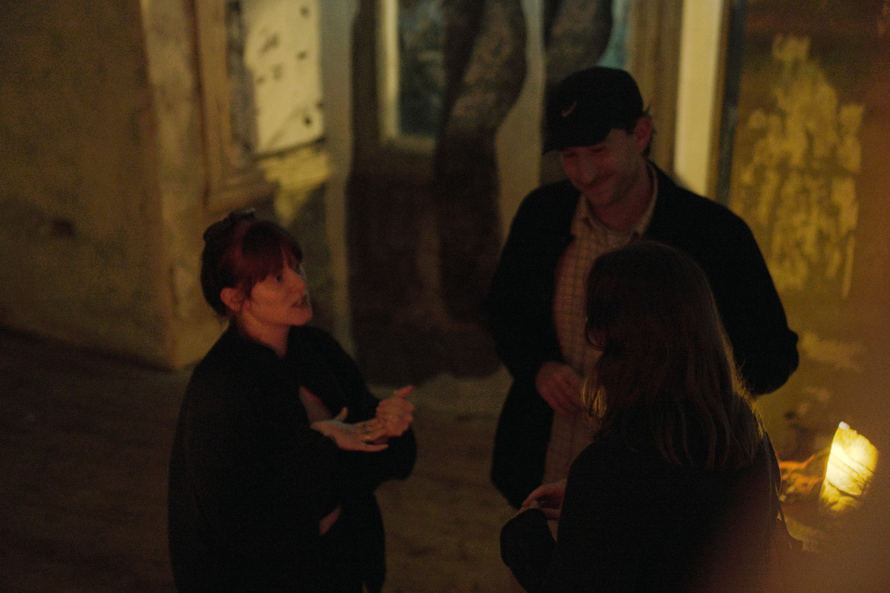 Visitors in a dimly lit room during Awakening at Safehouse in Peckham